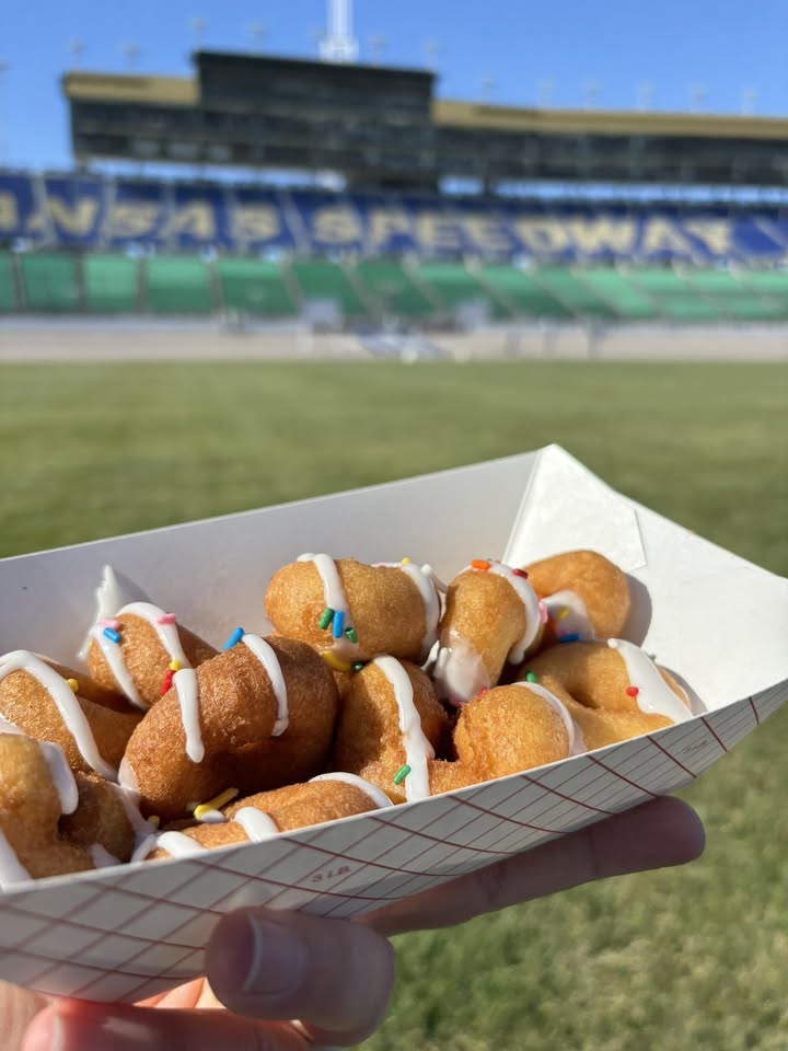 A tray of iced mini donuts held up in the stands at Kansas Speedway
